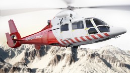 Medical evacuation helicopter in flight over snow capped mountains